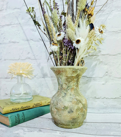 Upcycled ceramic vase in a mix of green colours with dried flowers